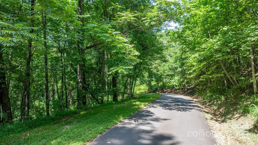 Welcome to Grants Mountain! Lot 58 on Mountain Crest Drive is a rare opportunity to build your dream home in a serene mountain setting. Recently graded within the past two years, this 8.70-acre lot is truly shovel-ready—the hard work has already been done for you! Offering both privacy and space to explore, this property provides the perfect balance of seclusion and convenience. Grants Mountain is a secure, gated community with 24/7 access control, giving you peace of mind in your investment. Ideally located just minutes from I-40, you’ll enjoy quick access to downtown Marion, only 20 minutes to Morganton, and just 45 minutes to vibrant Asheville. Don’t miss your chance to create your mountain retreat—schedule your showing today!