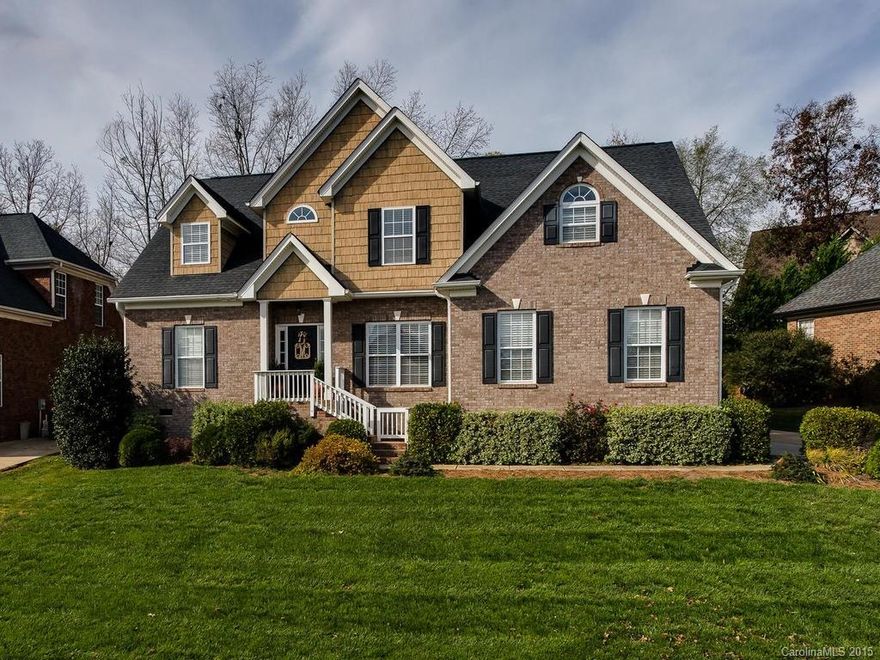 Beautiful Southern Elegance. Solid brick home welcomes you with rich hardwoods and formal dining room then relaxes into comfortable living areas where marble & millwork grace two cozy fireplaces. Kitchen offers your gourmet plenty of room with views of back deck & garden. Owners suite on main and 2nd suite upstairs. Lots of natural light from energy efficient windows throughout. Award winning Ft Mill School district location is convenient to shopping, restaurants in Uptown Charlotte & Ballantyne