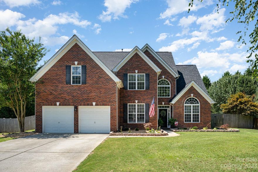 Welcome HOME. This exquisite residence offers an unparalleled blend of elegance, comfort, and modern living. Situated in a desirable all brick neighborhood, this home presents a remarkable opportunity for those seeking a serene lifestyle. As you step into this stunning home, you will be greeted by a sizable and open floor plan outfitted with hardwood floors and high ceilings. The primary bedroom located on the ground floor is a true oasis, complete with an ensuite bathroom and walk-in closet. The kitchen provides an ample amount of space and is equipped with granite counter tops. Whether you're preparing a casual meal or hosting a grand dinner party, this kitchen is sure to impress. Downstairs you will find the large living room area complete with a gas burning fireplace, a private office, and a formal dining room. Upstairs you will find 4 more bedrooms, as well as a full bathroom. Moving outdoors, the back yard is meticulously landscaped and is perfect for entertaining.