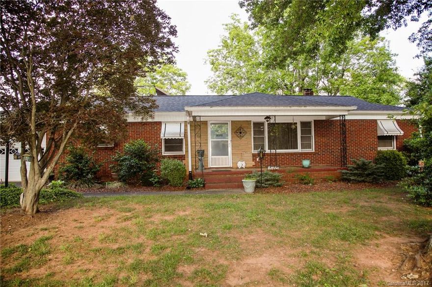 One owner home with lots of potential on 2.29 acres including a detached 2 car garage with electricity and water, even a wood stove. Kitchen has lots of charm with many cabinets. Den area has knotty pine walls. Seller says there are hardwood floors under some of the carpets. Outdoor areas are beautiful with mature trees and 5 large pecan trees. Come take a look at what this home can be with a few updates. Property being sold AS-IS!