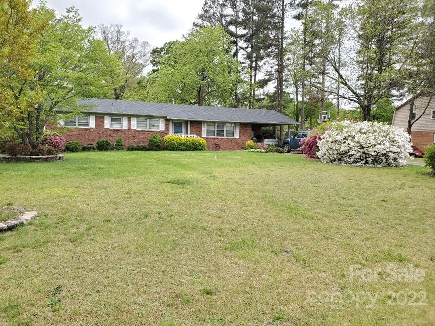 Come and see this nicely updated brick ranch close to down town Rock Hill! This home in the established Eastview neighborhood has been freshly painted and had new flooring installed. Refreshed cabinets with custom epoxy counter tops adorn the kitchen. This home features a large living room and dining area with a built-in desk. The main hall bath has a separate shower and tub and a second half bath adjoins two of the bedrooms (jack-and-jill). The remaining bedroom features a walk-in closet. This home also features plenty of storage; there is a storage room in the carport area, a large shed that conveys, and a 2-story playhouse or storage building, all which have electric run to them. New roof 2022!