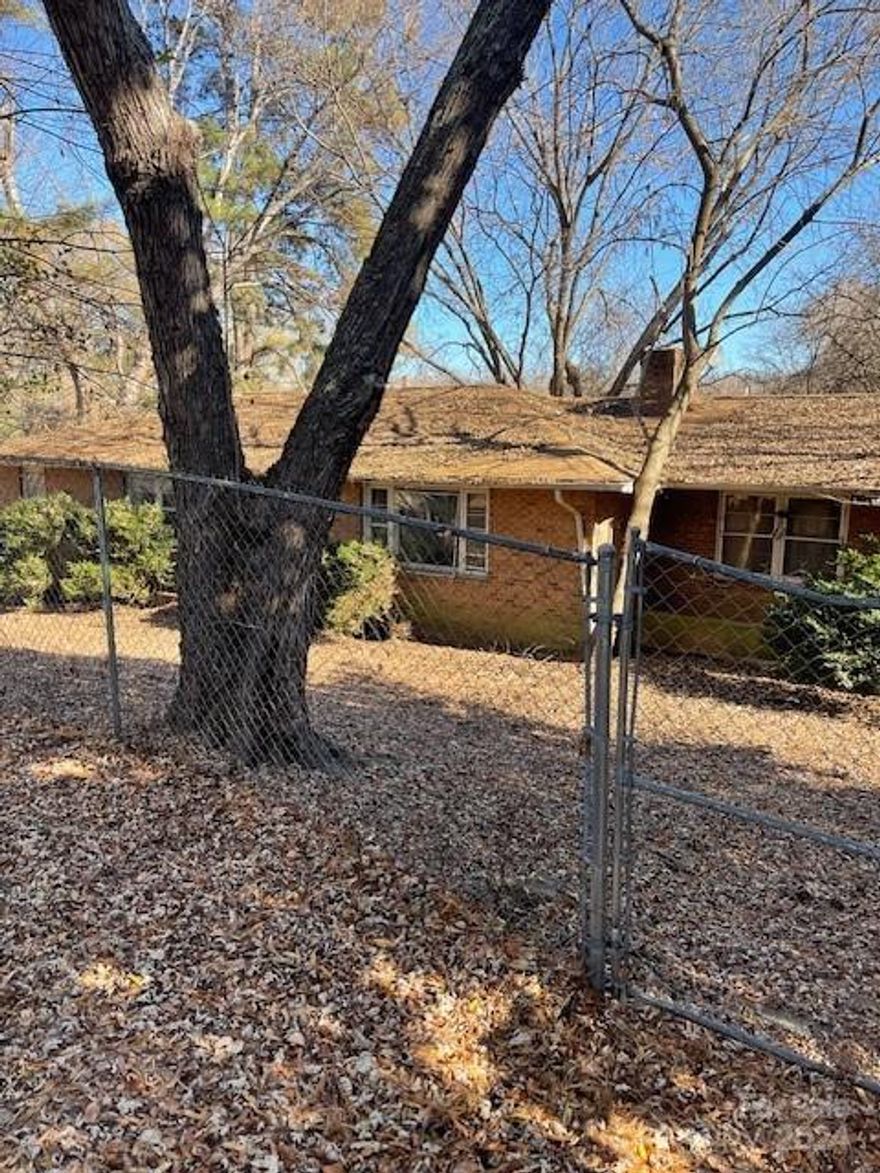 3 BD 1.5 BA brick home is situated on 1/2 acre lot in Spencer NC. There has been a fire inside of home and price is reflective of condition of interior of home. Property is in an estate and subject to court approval. Great location in Spencer across the street from the High School. Conveniently located near shopping, businesses and super quick access to I-85 ramp for commuters. 1 mile from North Carolina Transportation Museum which hosts events throughout the year.