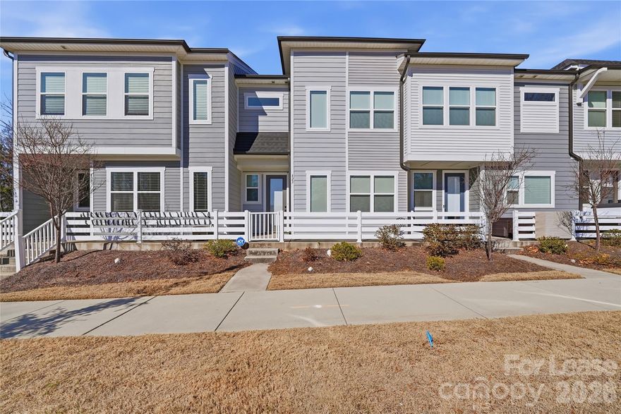 Beautiful 3-bedroom, 2.5-bath townhome with a 2-car garage, featuring a clean, modern kitchen with warm neutral tones and upscale finishes. The kitchen offers shaker-style cabinetry and stainless steel appliances, including a French-door refrigerator. The spacious primary suite includes a private bath and walk-in closet. Upstairs, at the top of the steps, you’ll find a versatile bonus room/loft—perfect for a TV room, game room, or additional living space. Washer and dryer are included for added convenience. A well-designed home that blends style, comfort, and everyday functionality—ready for you to move in and enjoy.