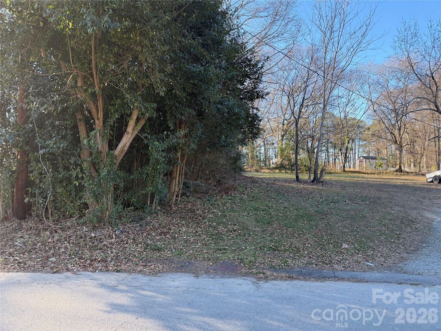 LAND OPPORTUNITY IN GASTONIA! Explore the potential of this 0.3-acre lot located at 413 Beech Street. This property is partially cleared, offering a head start for your vision while retaining some natural landscape. Situated in a convenient Gastonia location, the lot provides easy access to local amenities and is ready for its next chapter.

Public water is available at the street; however, the public sewer line is located further down the road and may require an extension to service the property. Additionally, please be advised that the neighboring driveway encroaches onto the property. The seller is working with the neighbor to move the driveway to alleviate the encroachment. This is a unique opportunity to secure land in an established area with significant development potential.