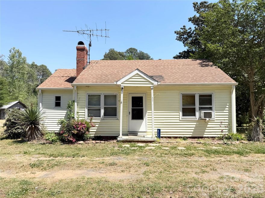 Don't miss this charming property just south of uptown Wadesboro! This cozy home has a desirable open floorplan with the living, dining and kitchen areas all visible to one another. A beautiful fireplace becomes the centerpiece of the living room, and a large laundry area is accessible from the living room.  A 12x12 deck overlooks the large backyard that provides ample space for outdoor living. A walk-in basement crawlspace offers storage space and easy access to plumbing, electrical, and duct work.