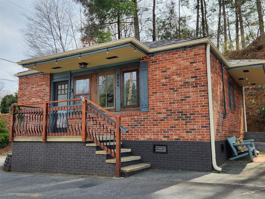 This cute and quaint in-town Waynesville property is currently being used with great success as a vacation rental home. The stand-alone, solid brick building has had many wonderful recent upgrades and renovations, including: new well-appointed kitchen complete with new appliances (dual-fuel stove), luxe walk-in tiled shower, tankless gas hot water heater, etc. With its mixed use residential/commercial zoning and abundant off-street parking, 110 Summit is ideally suited for a wide array of uses. The bonus room off the bedroom is a great additional sleeping or office space. Seller intends to sell the property fully furnished, and the decor is very nicely done.