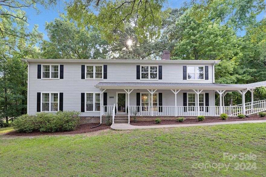 Indulge in ultimate luxury with this sprawling, open concept home located on a forested .91 acre corner lot. No HOA! The home has been updated in a high end fashion- every detail was thoughtfully curated for the most discerning buyer. Main level contains a gourmet eat-in kitchen with loads of cabinetry, SS appliances, massive center island and quartz countertops. A wet bar, custom laundry room, large bedroom/office, living room and family room are also located on the main. Direct access to the backyard from the bar area is perfect for morning coffee and listening to the sounds of nature! Upstairs hosts 3 additional bedrooms, as well as the luxurious, oversized primary suite: dual closets, separate shower/bathtub, all tile and high end fixtures. Large two car detached garage plus a built-in shop. The backyard is large, flat and great for being outside. The Carowoods neighborhood is truly a hidden gem - established and very low turnover. Fort Mill Schools and minutes away from I77.