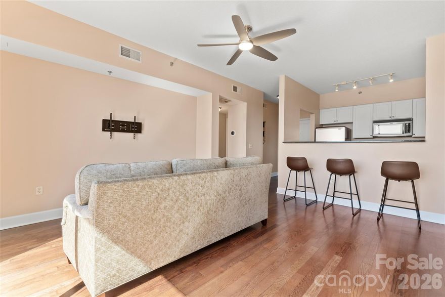 Welcome to your new home! Located in the highly desirable area of Dilworth, this 1BR unit is located on the 7th floor of 1315 East, offering expansive views of the area via your own private balcony! Move in ready, Open-Concept condo w/ SS Appliances, Granite Countertops & Breakfast Bar in Kitchen w/ wood style flooring throughout the main living areas. Refrigerator, and Washer/ Dryer convey w/ acceptable offer! Building amenities include Secure Entrance/Parking Garage, 6th Floor Gym & Rooftop Terrace w/ views of uptown CLT. This building is within walking distance to Everything Dilworth has to Offer -- Resturant Row, Starbucks, Retail, Grocery, & Freedom/Latta Park!  Home is now vacant and easy to show!