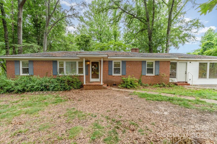 Welcome to wonderful Sharon! This rural multi-acreage property features outside storage sheds, a two-car carport, concrete parking pad, and a private lot with mature shade trees. The inside of the home is ready for your finishing touches! The interior features the following potentially unpermitted areas: sunroom or enclosed porch at the back exterior, an enclosed large laundry/storage room, and an enclosed carport extended to make a large bonus room. Enjoy two spacious bedrooms, an office or flex room, hardwood floors, LVP flooring, a fireplace, a kitchen island, a pantry, a large dining room, an open floor plan and so much more!