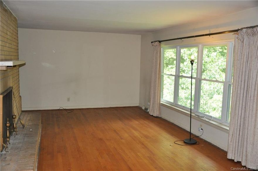 Classic 1960's All Brick Ranch with Basement, rest on 1.4 acres in the heart of Charlotte. The home features fabulous Hardwood Floors throughout the main living level, and has endless potential as an investment for anyone willing to put in a little TLC. Easy commute to I-85, I-77 and minutes from Uptown. Needs work to be move-in ready.