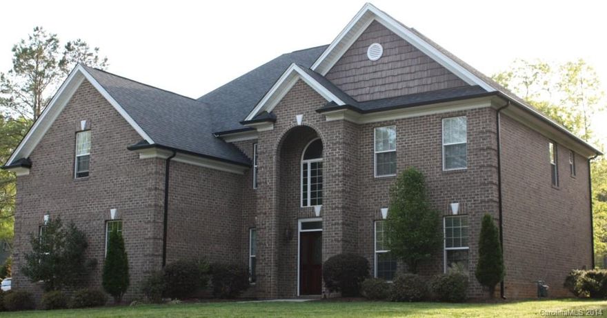 Beautiful all brick 5 BR, 3 1/2 BA home on 1.19 acres!  Many updates...

LG Stainless Refrigerator (2013) 
LG Stainless Gas Stove (2013) 
LG Stainless Microwave (2013) 
LG Stainless Dish Washer (2013) 
Aluminum fencing in back yard (2013) 
Ceramic Tile Floor on main level (2013) 
Garbage Disposal (2014) 
Tank-less Hot Water Heater (2014) 
Carpet upstairs (2014) 
Garage Door Opener (2014) 

Nothing to do but move in and enjoy!  Easy to get to Mooresville, Charlotte, or the Airport!