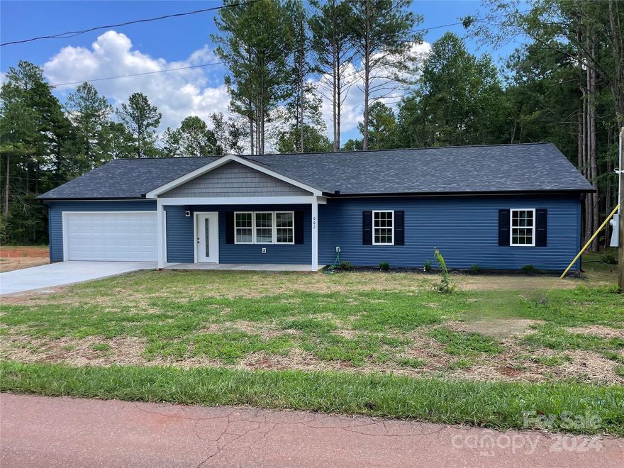 Public Remarks Absolutely adorable brand new ranch. Relax in your rocking chair on this cozy front porch or enjoy the privacy on the rear deck. This 3 bedroom/2bath home will satisfy your pickiest buyers! LVP flooring in main body, tile in primary bathroom and carpet in bedrooms. This perfect kitchen has a center island, granite countertops and stainless appliances. 9 ft ceilings thru out, oversized 20' x 34' garage with a 16' wide door. Spacious closets and pantry. Granite countertops in both secondary baths. Right down the road from Lincoln Charter School.