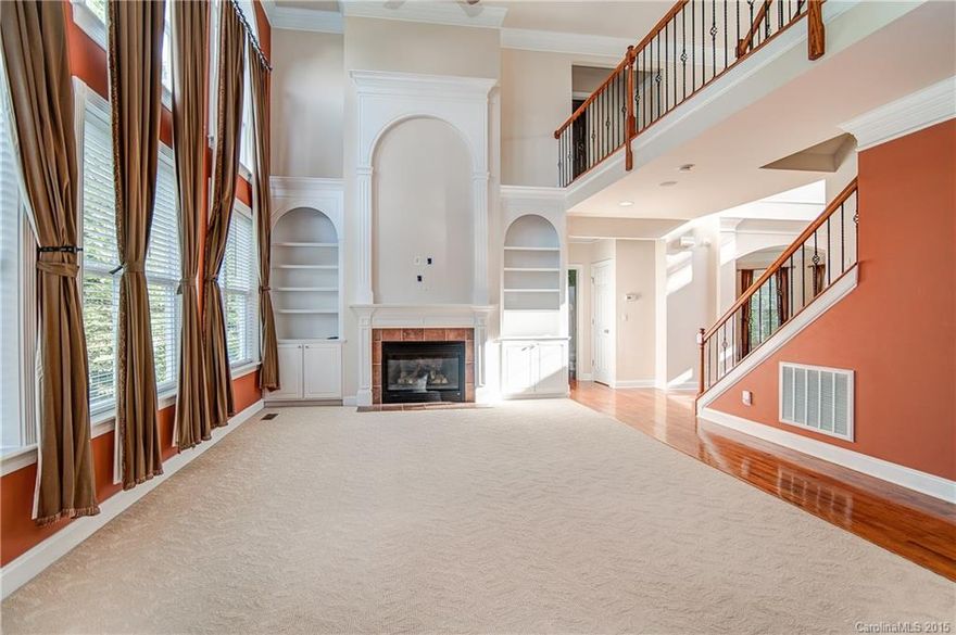 ABSOLUTELY THE BEST BUY IN CORNELIUS!  NEW PRICE PLUS $5,000 Buyers closing costs w/contract on or before 10/1/15 Sought after Neighborhood and Schools.  Move in Ready!  2-Story Great Room w/beautiful built in bookcases and a wall of windows creating lots of natural light.  Lge Kitchen with Granite and SS Appliances, Large 4 Bedroomed home with an Office/Play Room on 1st Floor/potential 5th Bdm Huge Master Suite with private sitting rm. Rec Room on 3rd Floor, Screened Porch and a beautiful Deck.