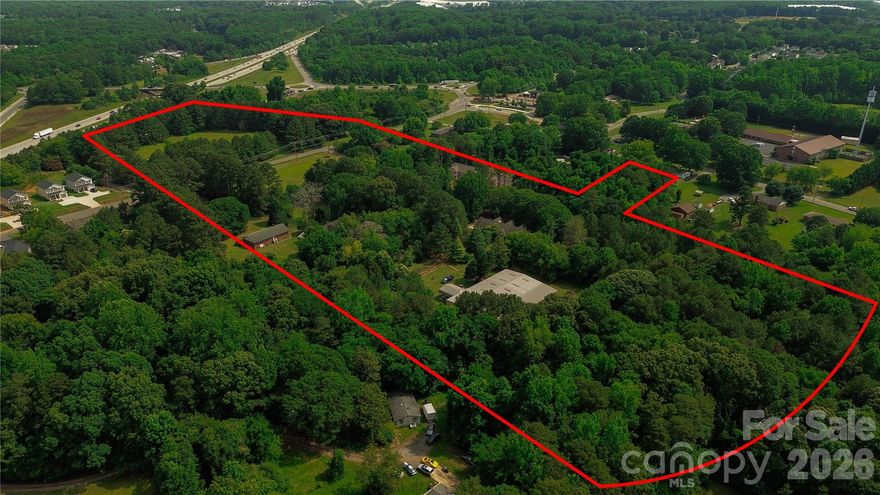 17.66 Acres +/- Prime Development Opportunity – Dilling Assemblage | Charlotte, NC

Rare opportunity to acquire a strategically located assemblage in one of Charlotte’s rapidly expanding growth corridors. The Dilling Assemblage consists of multiple contiguous parcels currently zoned N1-A and N1-B, offering significant frontage, strong accessibility, and exceptional long-term development potential.

Preliminary conversations with City of Charlotte planning staff have indicated potential support for higher-density residential and/or commercial urban plan rezoning concepts, particularly when presented with a creative development plan designed to meet both current and future community needs. This creates a compelling opportunity for builders, developers, and investors seeking a large-scale project in a rapidly evolving area of Charlotte.

The property is ideally positioned within minutes of the U.S. National Whitewater Center, major transportation corridors, employment hubs, retail growth, and expanding residential development. The location continues to benefit from strong population growth and increasing demand for housing, mixed-use environments, and neighborhood-serving commercial services.

Water, sewer, natural gas, and fiber infrastructure are currently located roadside along the property, further enhancing the site’s development potential.

Key Highlights:
• Approx. 17.66 acres +/-
• Multi-parcel assemblage with substantial development scale
• Current zoning includes N1-A and N1-B
• Preliminary discussions suggest potential rezoning opportunities for higher-density and commercial urban plan concepts
• Excellent opportunity for creative mixed-use or residential development
• Favorable topography and strong access
• Located near major growth corridors and employment centers
• Minutes to the U.S. National Whitewater Center
• Two existing rental homes currently producing income
• Two additional owner-occupied homes could potentially be leased during planning and entitlement phases for interim revenue generation
• No known long-term lease encumbrances impacting redevelopment flexibility

Don’t miss the fly-over video showcasing the assemblage, surrounding growth, roadway access, and nearby development activity.

IMPORTANT:
Do not enter, walk, or tour the property without a confirmed appointment. Owners and tenants currently occupy the properties. All site visits and showings must be coordinated and approved in advance. No interior tours of tenant-occupied or owner-occupied homes permitted until OTP (Offer to Purchase) or LOI (Letter of Intent) phase.

Buyer to verify acreage, zoning, utility availability, development suitability, and future rezoning potential.
