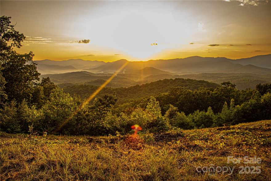 Not all luxury is built. Some of it is discovered.

An extraordinary opportunity awaits within New Forest Mountain—over 60+ acres of gated, infrastructure-ready land anchored by one of the most compelling natural features in Western North Carolina: your own private ±175-foot waterfall, cascading through the heart of the property and setting the tone for a sanctuary that is both powerful and serene.

This is far more than a mountain tract. It is a rare convergence of scale, water, elevation, and readiness—a setting where sweeping, unobstructed mountain views frame a landscape shaped by flowing creeks, quiet forest paths, and dramatic changes in terrain. Here, every step feels intentional, every vista earned.

Private trails invite exploration—leading to sandy-bottom streams, shaded swimming holes, and the waterfall itself, where a natural rock ledge forms a cooling cascade and an unforgettable sensory experience. The sound of moving water, the stillness of the forest, and the privacy of the land create a sense of calm that is increasingly difficult to find.

Beyond the waterfall, the property features a tranquil man-made pond, meandering creeks, abundant wildlife, and multiple cleared homesites, each thoughtfully positioned to offer privacy and commanding outlooks. The foundation is already in place: underground power and water access are installed, allowing you to move directly into the building phase—whether your vision is a refined mountain retreat, a contemporary glass residence, or a collection of cabins designed for family, guests, or legacy use.

Located within a secure, gated mountain community, this tract balances seclusion with accessibility. Enjoy proximity to everyday essentials while remaining centrally positioned—approximately one hour to Asheville or Greenville/Spartanburg, 1.5 hours to Charlotte, and just minutes from Lake Lure, Chimney Rock, and Hendersonville for dining, recreation, and seasonal events.

Notable Features:

• Private ±175-foot waterfall—rare, dramatic, and entirely yours
• Over 60+ acres of diverse, usable terrain
• Multiple cleared homesites with long-range mountain views
• Underground power in place; water available
• Pond, creeks, trail system, and natural recreation areas
• Gated setting offering privacy and peace of mind

Additional acreage and unique features may be available by request, including access to a private natural cave, expanded homesites, and extended mountain views—with the potential to combine into a much larger legacy holding.

Properties of this caliber—especially those defined by water, views, and readiness—are exceptionally difficult to replicate at any price point.
Proof of funds or pre-approval required prior to touring. Agent-accompanied showings only.

This is a land offering that must be walked, heard, and felt to be fully understood.