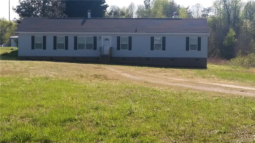 Beautiful 4 BED/2 BA  modular home, located in the country with lots of privacy. Nice large 1 acre lot. Spacious living room w/fireplace-flanked by built-in bookcases. Kitchen has large Island & Office Nook. Huge master Bed/Bath with Garden Tub, full shower & walk- in closet.  Large utility room with outside entrance.  PRICED BELOW TAX VALUE-WONT LAST LONG AT THIS PRICE!!!