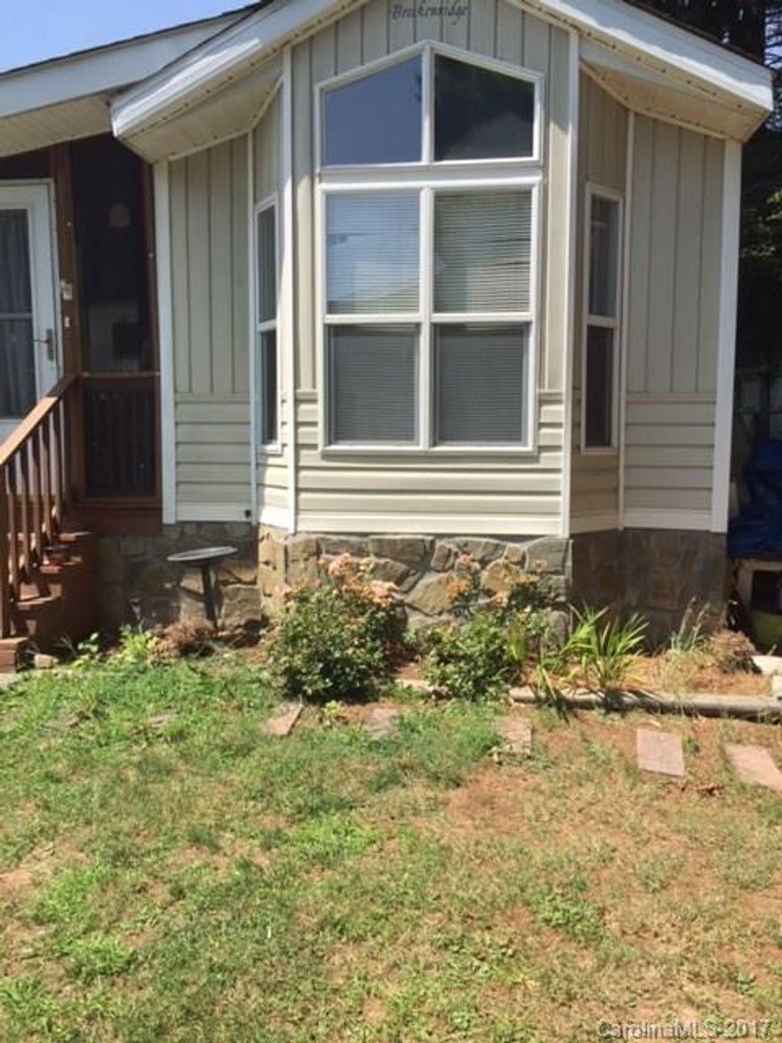 EASY LIVING IN THIS PARK MODEL WITH ADDED COVERED PORCH, LAUNDRY ROOM ADDITION WITH EXTRA STORAGE, 2ND BEDROOM AND 2ND BATHROOM.  YEAR ROUND ACCESS AND IN A CUL-D-SAC WITH MOUNTAIN VIEWS OFF BACK PORCH.  PRIVACY ON FENCED SIDE. MAY BRING YOUR PET. CAN LIVE THERE YEAR ROUND OR ENJOY SPENDING YOUR SUMMERS IN MAGGIE VALLEY WITH ALL IT HAS TO OFFER ANY TIME OF THE YEAR.CITY WATER AND SEWER. LEASED LOT IN COMMUNITY CAMPGROUND.