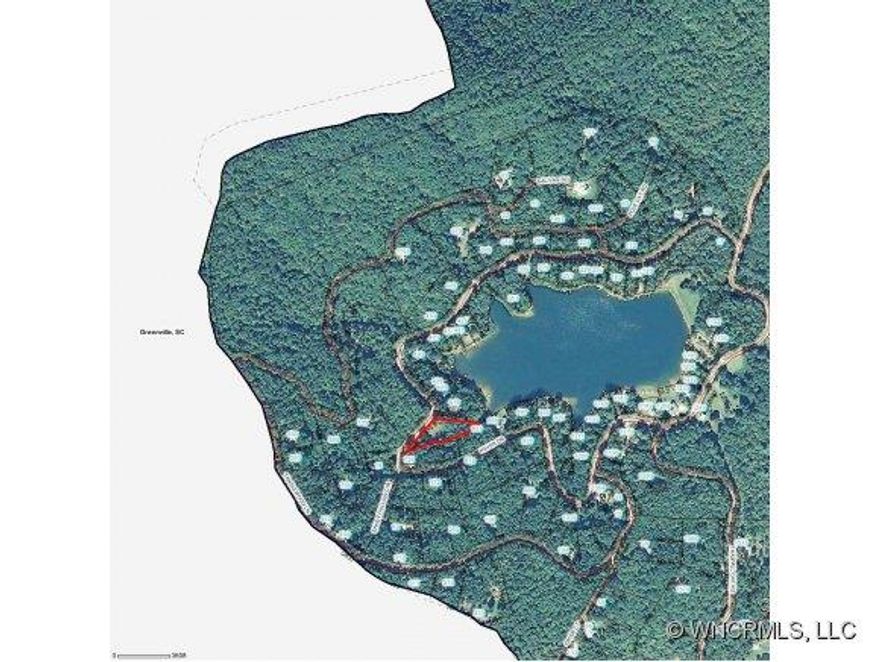 Lakeside lot with pedestrian easement to lake. Site cleared for house with driveway cut in, 3-bedroom septic installed, water tap installed. Lake Sheila is a 28-acre private, pristine mountain lake surrounded by 19,000 acres of preserved watershed.  Great for swimming, fishing, kayaking, paddle boats, canoes.