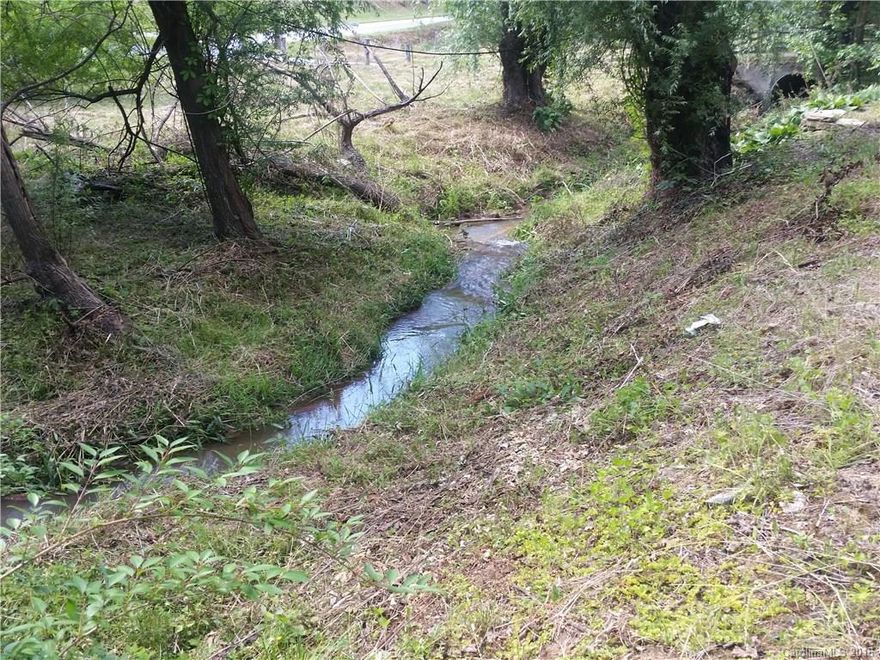 Possible slab & block walls that could be used after inspection by a qualified builder. This creekside lot has a creek, septic and city water. Paved access minutes from the town of Clyde - midway between Asheville, Waynesville & Interstate to everywhere. 7 minutes to the hospital, Haywood Community College & shopping. Priced to buy - make sure you check this creekside location out. Additional 1.94 acre creekside lot available, see MLS 3180387.