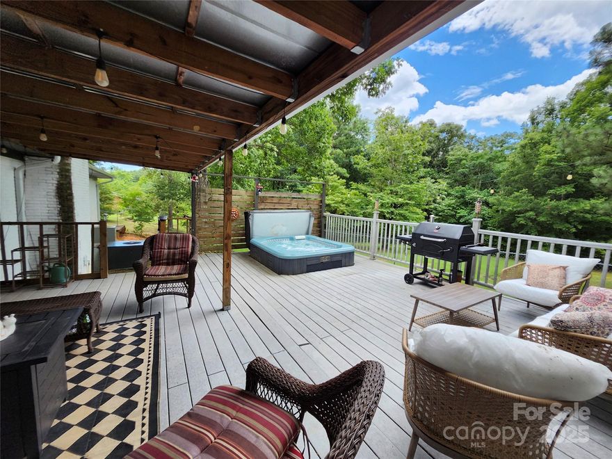 Welcome home to your private oasis on 1 acre and a pond. Take in the sounds of nature from the relaxing hot tub on the deck. Enjoy easy living in this sprawling brick ranch with an open floor plan, updated kitchen, and board-and-batten laundry room. You'll find 3 full bathrooms, all updated and connected to a bedroom. The original garage was transformed into living space with a large closet and attached bathroom, which has multi-uses, such as an in-law suite with separate entrance, a rec-room, home gym, office space, art/photo studio, it can be whatever you want it to be when this house becomes your home. There is a detached garage, and a generously sized fenced area of the backyard. Seller's are motivated.