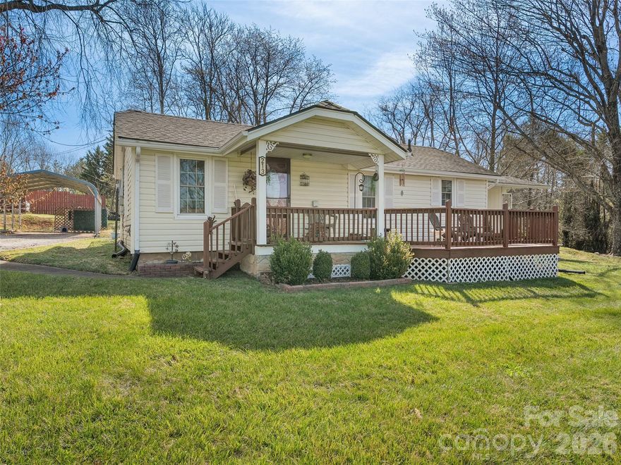 Step into the charm of this classic 1940 farmhouse-style home, perfectly situated on a spacious 0.68-acre level to gently rolling lot. This inviting two-bedroom, two-bath residence offers the perfect blend of timeless character and modern convenience. The heart of the home is the spacious eating kitchen, filled with natural light and plenty of room for family meals and casual gatherings. Adjacent is the cozy living room, complete with a versatile home office or bonus room area—ideal for remote work, hobbies, or extra living space. The primary bedroom is truly spacious and features a generous walk-in closet, a private full bath, and walk-in shower. The second bedroom provides comfortable accommodations for family or guests. Outside, enjoy the large front deck—partially covered—for relaxing evenings or morning coffee while taking in the peaceful yard. Recent updates include architectural shingles,   Vinyl siding and energy-efficient vinyl windows, ensuring low maintenance and comfort for years to come. Practical features include a one-car carport, slab/crawl spacecity water, septic system with updated tail lines. The gently rolling yard offers ample space for gardening, play, or simply enjoying the outdoors. Located just minutes from local shopping, restaurants, and easy I-40 access, this farmhouse offers the best of small-town living with convenient access to everything you need. Whether you’re looking for a peaceful retreat or a charming forever home, this 1940 gem is ready to welcome you. Mailing address is 213 Dewey Ave.