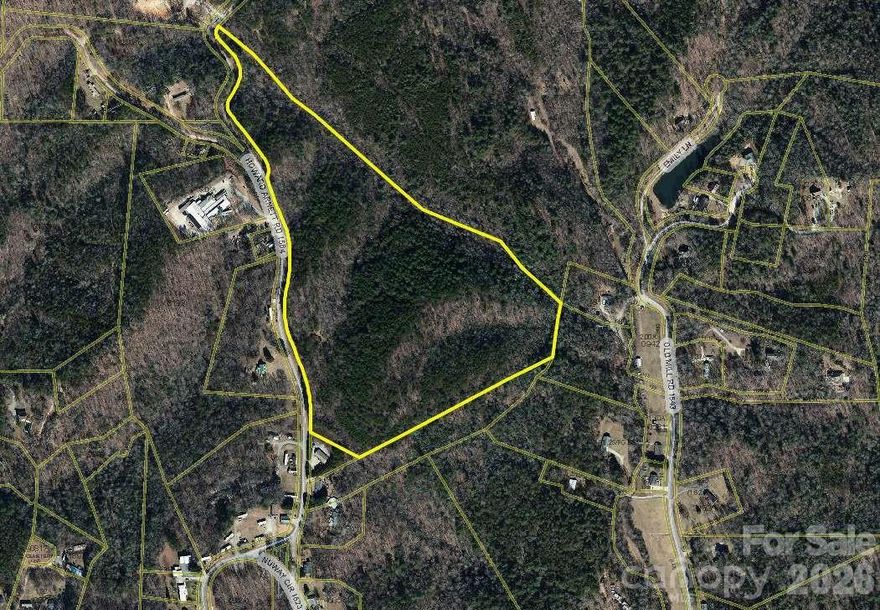 Discover the perfect blend of privacy, convenience, and developer's opportunity with this expansive 36.57-acre parcel. Located just outside the Lenoir city limits with only 1.5 miles from Hwy 321. Zoned RR ( Rural Residential) this property offers approx. 1,400 feet of road frontage, making it highly accessible for various uses like single-family homes, modular homes, double-wides, group home facility and potential for rezone to commercial. It has access to city water. Septic needs to be installed, however city sewer is located just 600 meters away. Ready to be subdivided with only 15,000 sqft of min. lot requirement for SFH and 18,000 sqft for duplex. The land is partially cleared at the front, with varying slopes in the back and a peaceful creek on the NE corner.Just 30 mins from Blowing Rock, Boone and 1 hour to charlotte airport. Min. lot setbacks information is available on request. Look for Parcel-ID 09166 1 11A to look up on GIS.