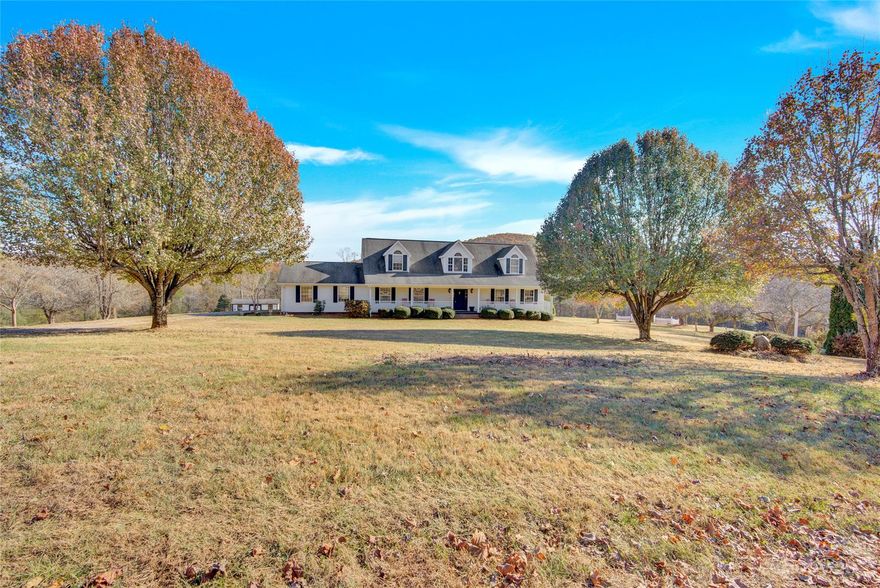 **MULTIPLE OFFERS RECEIVED- HIGHEST & BEST BY 9PM, SUNDAY NOV 25th** Looking for PEACEFUL, PRIVATE, COUNTRY living?!? This one is perfect for you!! Large 8.7 acre tract. Land is open & mostly flat with stunning mountain views & a creek that runs through the back of the lot. Home features 3 bed/2.5 bath, a bonus which could easily be used as a 4th bedroom & a loft area. Large primary on main with a walk in shower, garden tub & two walk in closets. Open concept kitchen features stainless steel appliances & a breakfast bar overlooking the dining room & living room. Enjoy a cup of coffee on your covered front porch or overlooking the changing leaves from your back deck. New paint & carpet 2022. New HVAC 2021. Small animal (donkey) barn & hay barn convey. SO MUCH potential & opportunity with this large tract of land!! Book your showing today!