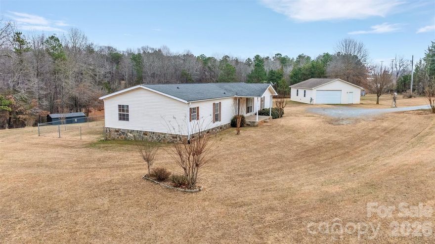 Peaceful country living awaits on 10.2 acres of natural beauty. This 3-bedroom, 2-bath manufactured home offers scenic nature views and total privacy. Enjoy quiet mornings and wide open space, surrounded by trees and wildlife.  Cozy up and relax on those warm or cool evenings under the covered gazebo beside the pond. The gazebo includes lighting and power, making it perfect for casual gatherings, evening dinners, or simply enjoying the stars. The setting feels secluded and serene, yet the property is conveniently located near Spartanburg, Gaffney, and Greenville, for access to shopping and services. Ideal for anyone seeking comfort, tranquility, and room to breathe, blended with a rural feel with practical convenience.