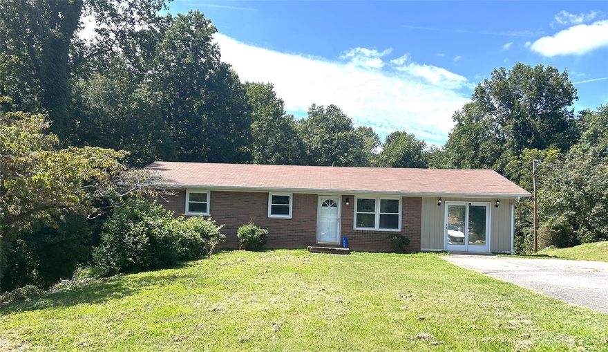 PRICE IMPROVEMENT!! Back on the market at NO fault of the seller! Great location! Just minutes from I40, this home is conveniently located just off the Hwy 321/127 interchange. Home offers over 1300 sq ft of living area and a full basement, 3 bed, 2 bath, large family room and a garage type entrance on the left side of home in basement, perfect to store lawn equipment,bikes,or atv. Basement has lots of potential, could be used as a man cave, playroom or entertainment. Home remodeled in 2015.  Great quiet and peaceful neighborhood with city water and NO HOA. Washer, dryer and air purifier to transfer with property. This is a must see!!