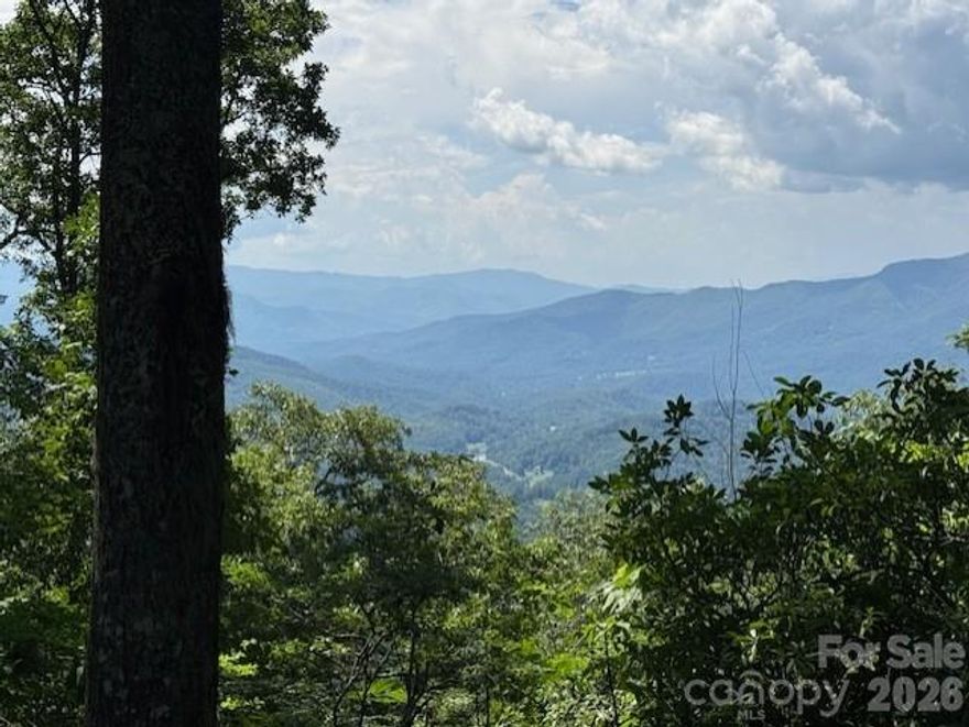 This homesite boasts one of the most spectacular views, both East and West, in all of Balsam Mountain Preserve. It sits at nearly 4,500 feet of elevation.  A perfect home design would feature a home that can take advantage of opening up the home on both sides to allow an incredible breeze as you take in the spectacular Plott Balsam Mountain range. This homesite must be seen to be appreciated.  Balsam Mountain Preserve is a private 4,400-acre club community with 3,200 acres of conservation land and completed amenities featuring golf, equestrian, scenic trails, tennis and dining. The stunning new facilities at Doubletop Village, including the Summit House Restaurant and Mine Tavern, are now open to members and their guests.