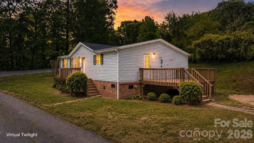 Private and move-in ready 3BR/2BA home situated on 1.2 wooded acres offering space, flexibility, and a peaceful setting just outside of town. This home features an open living area, large kitchen with abundant cabinet space, stainless range, ample countertop workspace, and a dedicated dining area perfect for everyday living.

The spacious primary suite includes a large ensuite bath with double vanity, garden tub, separate shower, and generous closet space. Fresh, clean interiors with updated flooring and neutral finishes make it easy for the next owner to move right in and make it their own.

Enjoy outdoor living with both front and side decks, ideal for relaxing, grilling, or entertaining while overlooking the wooded surroundings. The oversized lot offers additional parking, flexibility, and potential for future use.

Conveniently located just minutes from Drexel, Morganton, local schools, shopping, dining, and easy access to I-40 and Highway 70, this property offers both privacy and everyday convenience.

A great opportunity for primary living, rental investment, or a peaceful mountain-area getaway.