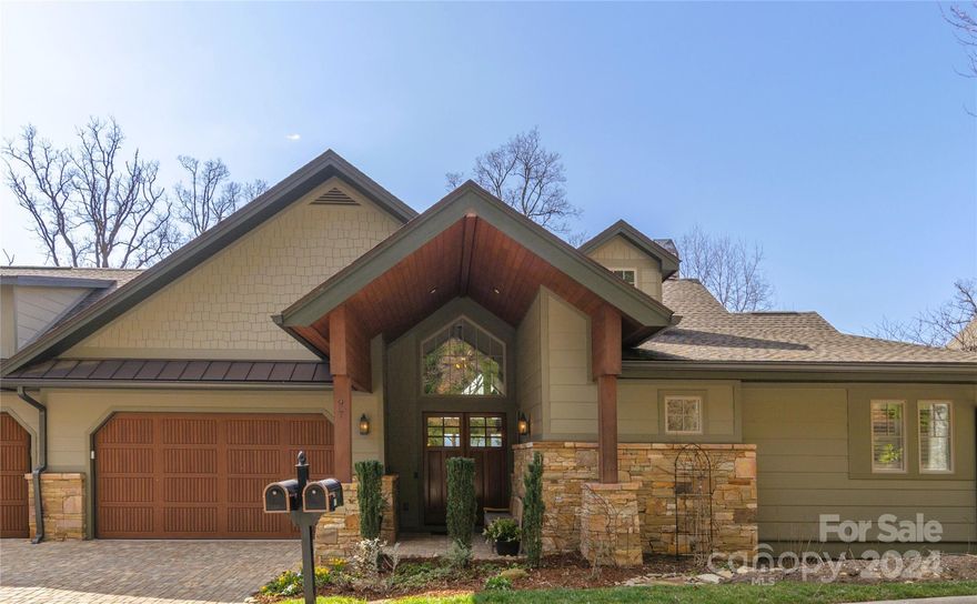 Sit high on the mountain in this luxury townhouse only 2.5 miles from downtown Asheville. Cool and contemporary in design, with beautiful views of the Blue Ridge Mountains. Completed in 2017, the home feels brand new. Classic marble countertops and high-end finishes throughout. An inviting home with great flow and spacious areas for entertaining. Everything you need on the main level, with plenty of private, guest/family space below. Even from the lower level, no one will complain about the view!  Just enough gardening space outside to fill your gardening needs if your heart desires, or simply relax and watch the perennials and native plants do their thing.  Enjoy Reynolds Mountain's private hiking trails, picnic and recreation areas, along with close proximity to Reynolds Village shops, gyms and other amenities. Easy access to I-26.