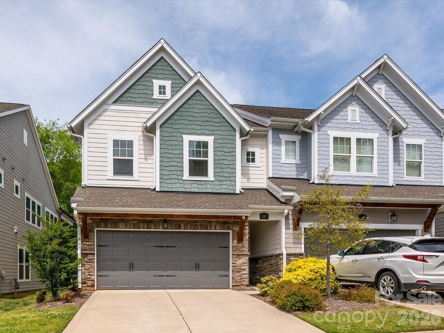 Experience the perfect blend of city energy and residential tranquility at 1217 Drummond Ave. Situated in the heart of Villa Heights, this 2022-built "Duet" townhome offers an unbeatable lifestyle, just a short, leafy stroll from the eclectic hubs of NoDa and Plaza Midwood. Start your mornings at the local coffee shop or wind down at the neighborhood cocktail bar—both less than a block away.  

Inside, the home is a masterclass in light and scale. Massive windows flood the open-concept main level with natural radiance, highlighting custom designer lighting and pristine finishes. The chef’s kitchen is the true centerpiece, anchored by an expansive quartz island with a beverage fridge and ample storage—perfect for hosting weekend gatherings.  

Notable Highlights:
• The Ultimate Backyard: Boasting one of the largest fenced yards in the area, featuring a majestic oak tree, lush lawn maintained by in-ground irrigation, and a dedicated firepit area for cool Carolina evenings.  
• Smart & Sophisticated: Fully integrated smart-home tech, including automated shades in the primary suite, app-controlled HVAC and garage, and a comprehensive Ring security system.  
• Versatile Living: A private main-floor office offers a quiet retreat for remote work, while the upstairs bonus loft provides a secondary lounge or media room.  
• The Primary Retreat: Unwind in a suite designed for relaxation, complete with a private sitting porch, a spa-like soaking tub, and a generous walk-in closet.  
   
Move-in ready and meticulously improved, this home isn't just a place to live—it’s a gateway to the best of Charlotte living.