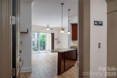 Photo of 4620 Piedmont Row Drive #304, Charlotte, NC 28210 (MLS # 4390013)