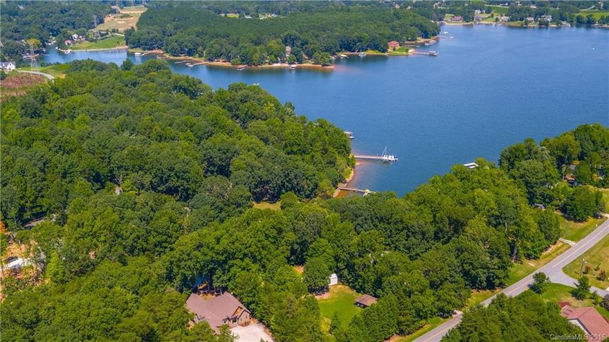 Gorgeous Waterfront Home!  Private pier and dock!  On a quiet cove only Minutes to the main channel! Gorgeous wood floors, travertine tile, beautiful moldings.Luxurious Master suite w/ huge walk in closet. Must see the basement rec/bar room and don't miss the "fishing room" which has a roll up garage door. Throw a line in or jump on your boat and go! Lake living at its best!  If you don't want to spend the next year renovating than this home is perfect for you. Exquisite Comfortable Elegance.