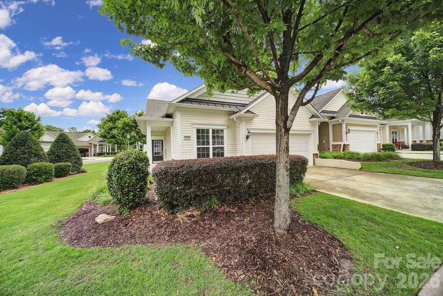 Move-in ready Villa with 2-car garage in sought-after 55+ Sun City Carolina Lakes! Private END unit, FRESHLY painted throughout with wood flooring in main living areas & NEW carpet in bedrooms. A separate study sits just off the foyer, ideal for a home office or craft space. Natural light streams into the living room with breakfast bar overlooking the kitchen featuring gas range, SS appliances, granite countertops, recessed lighting, & eat-in dining area. Refrigerator & washer/dryer included. The primary suite sits at the back of the home with double doors opening to the private ensuite bath, dual sink vanity, walk-in shower, & spacious walk-in closet. Just down the hall is the guest bedroom, hall bath & laundry room. Enjoy the summer breeze on the screened porch with ceiling fan or soak up the sun on the back patio overlooking shade trees for additional privacy. Epoxy garage floor. Enjoy resort-style amenities, social clubs, and minutes to grocery, restaurants, shops, medical & more! HOA covers lawn maintenance; mowing, edging, fertilizing, weeds, annual mulching. Master insurance policy on structure, exterior maintenance, irrigation system as well as access to all amenities including; indoor/outdoor pools, lakehouse, waters edge park, gym, softball fields, pickle ball, tennis courts, bocce ball, shuffle board and multiple stocked lakes for fishing, with endless walking trails. BONUS - Seller open to paying 1 year of HOA Dues with acceptable offer. Let's make a Deal!