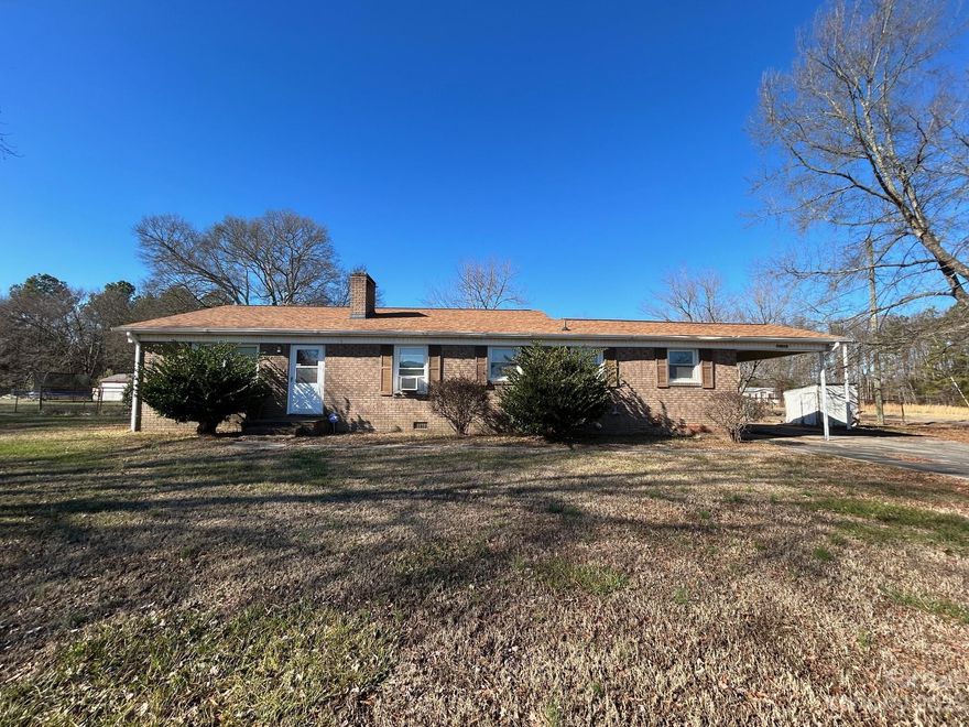 Well built full brick RANCH home situated on over a half an acre lot and conveniently located near all that the University area of N. Charlotte has to offer! Close to Highland Creek, Prosperity Church and 485. It is directly across the street from the Eastfield Meadows community, and close to shopping, restaurants and schools. This property is deal for a remodel to make it your own, or investment/rental property. 2 Bedrooms, 1.5 Bathrooms, Living Room, Great Room with fireplace, Dining area and Kitchen. Laundry is located off the 1-Car Carport. Roof was replaced in 2017. HVAC system does not work and a gas heater is currently being used in the house. All appliances convey and the property is being sold as-is.