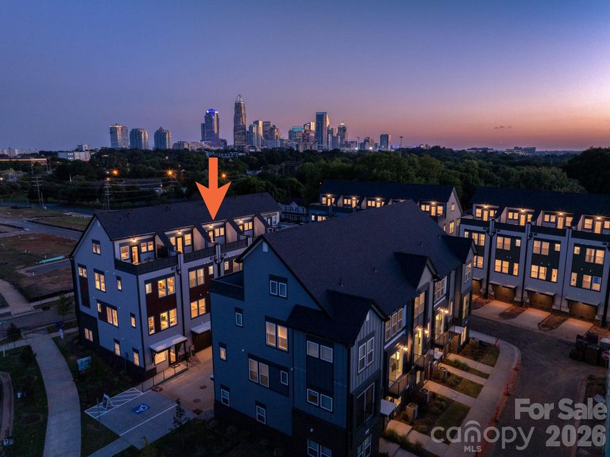 Want close proximity to Uptown Charlotte and Camp North End? This townhome offers that & much more. The 1st floor has a 1-car garage & Flex room w/ half bath, & the top floor has a Bonus bedroom & spacious rooftop terrace. The second floor has an open layout, plus a small deck off the kitchen. The Kitchen features 42" light grey cabinets, LED under-cabinet lights, trash pullout, large undermount SS sink, quartz counters, & GE SS app w/ gas range. The 3rd floor hosts both bedrooms and the laundry closet w/ tile floor. Full baths include quartz counters, white cabs, tiled floors. Premier Bath includes a tiled shower with semi-frameless surround and built-in shampoo niche. LVP flooring is throughout the first and second floors, plus third floor landing, with oak treads on all stairs and tile in the flex powder room. Ceiling fans are included in the flex, living room, premier suite and bonus bedroom. Walking distance to bars, restaurants, events, and more! Additional street parking is available.