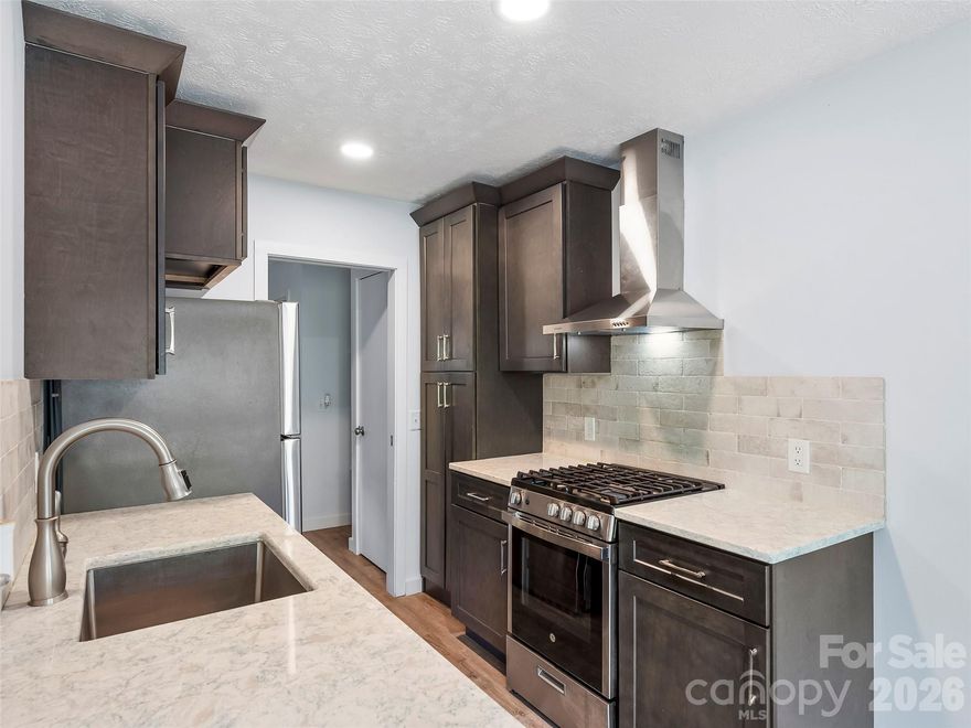 ALL UTILITIES INCLUDED IN HOA FEE, including internet.  STR's Allowed.  Welcome to effortless mountain living at The Mill House Lodge in historic Flat Rock. This beautifully renovated one-bedroom condo features an updated full kitchen with a gas range, updated bathroom, beautiful LVP throughout and a bedroom with built-ins for extra storage. The open living and dining area overlooks Jordan Lake and opens to a covered porch—perfect for relaxing and enjoying the water views.  The HOA fee includes all utilities, including internet, making ownership simple and worry-free.  Perfect for a full-time residence, weekend retreat, or income-producing second home.  Just minutes to Flat Rock Playhouse, Carl Sandburg National Park, Flat Rock Cinema, shopping, restaurants and more! 10 Min to Hendersonville.