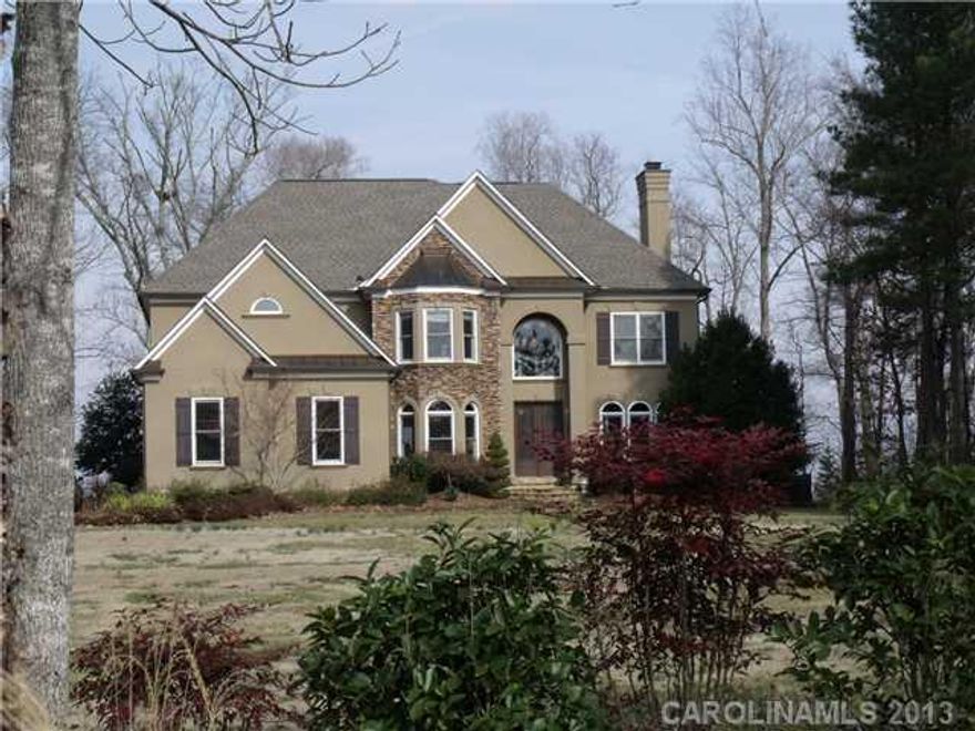 Attention to detail is evident through-out this beautiful lakefront home.  Spacious gourmet kitchen, high-end appliances & enormous island, wall of windows, beautiful hardwood floors, main level office & guest suite, luxurious master suite, each secondary br has its own private bath.  Outside has a gorgeous lakeside pool & patio for entertaining.  3 car garage, huge yard, private boatslip & more. Bank Approved short sale!  Must close quick.  Killer deal for someone who can close fast.    AS IS!!