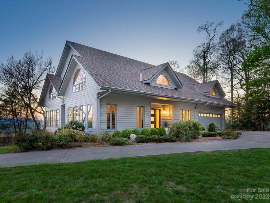 Nestled in Asheville's desirable Town Mountain, this dazzling home offers a mesmerizing vista with sweeping, endless long range views. The crisp, fresh mountain air envelops this luxurious residence creating a serene, peaceful oasis. Step inside, and the expansive living room welcomes you with soaring ceilings and large windows allowing natural light to flood in showcasing stunning, endless views beyond. A spacious gourmet kitchen opens to a huge deck and outdoor living space where you and your guests can watch the sun slowly set as the city comes to life at night with a million twinkling lights. The lavish Owner's suite features floor-to-ceiling windows, a huge walk-in closet/dressing room and spa-inspired bathroom offering panoramic vistas from the soaking tub, Every bedroom ensuite is designed for privacy and relaxation. Newly remodeled, idyllic downtown location, luxurious features, refinement, comfort and style all come together creating the ultimate living experience.