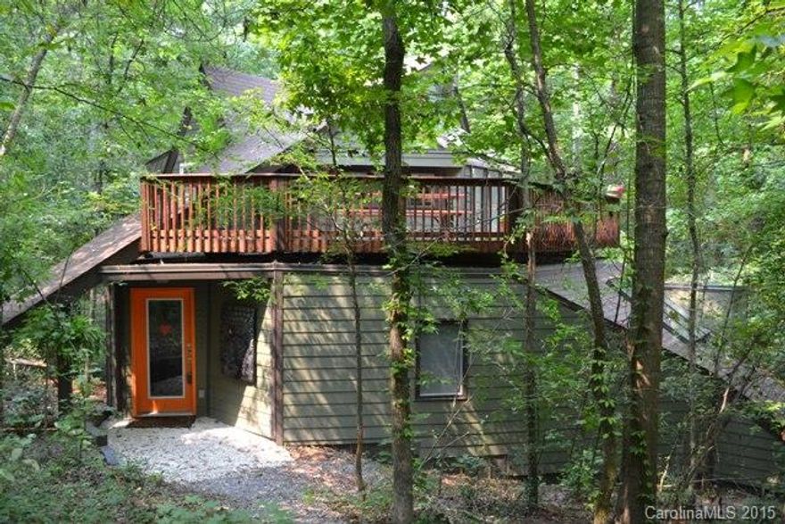 What a great opportunity to own a fabulous, custom built unique bungalow sitting on 2 acres by Lake Wylie!Land partially touches the water and you'll feel like you are in the mountains.You have your own private tree house w/ wraparound deck!  Gorgeous bamboo flooring in all areas and tile flooring in both baths.LR/DR have a built-in window seat and shelves, awesome quartz kitchen w/ stls. appliances, tons of cabinets, & counter space.Both BR could be used as the master. HGTV idea home inspired!