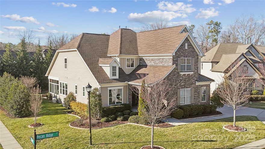 Welcome to Vintage Creek! This charming home sits on a corner lot in a peaceful cul-de-sac, surrounded by lush greenery. Upon entry, you're greeted by a stunning "Gone with the Wind" circular staircase and a grand two-story foyer. Made for entertaining, the gourmet kitchen with a large island flows into the family room, featuring a wall of windows that let in tons of natural light. The temperature-controlled sunroom offers year-round enjoyment. The primary bedroom and a guest room are on the main level, each with ensuite baths. Custom closets and cabinetry throughout keep everything organized. The spacious laundry room-complete with a sink and cabinetry, along with drop zone are just steps away from the breezeway leading to the third-car garage, making life just a little easier.
Upstairs, you'll find three additional bedrooms, a game room with built-in shelves and under mount lights, as well loft. The private, and spacious backyard is perfect for any occasion. Welcome home.