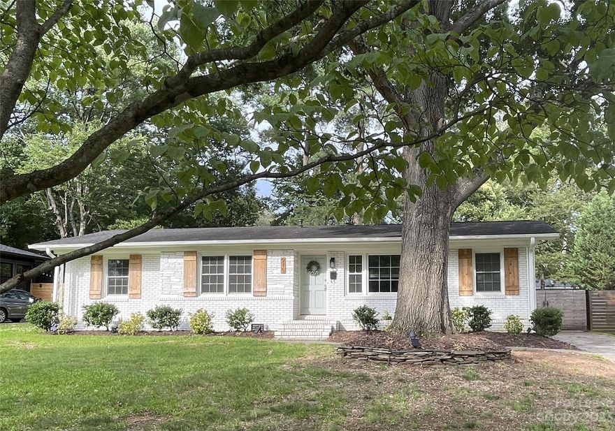 LOCATION, LOCATION AND CHARMING DETAILS WILL DELIGHT YOUR SENSES IN THIS WELL THOUGHT OUT RENOVATED RANCH HOME IN ONE OF CHARLOTTE'S MOST DESIRABLE NEIGHBORHOODS NEAR SOUTHPARK WITH QUICK ACCESS TO I-77 IN MONTCLAIRE!!! YOU WILL ENJOY THE LARGE LEVEL PLUSH GRASS & NIGHTSCAPE LIGHTING ON THE TALL MATURE TREE LINED BACKYARD. BAR-B-QUE ON THE GAS GRILL BY STRUNG LIT PATIO. PRACTICE LACROSSE OR SOCCER IN THIS QTR OF AN ACRE FENCED BACKYARD. BEAUTIFUL WHITE CABINETRY W/ CORNER GLASS CABINET ACCENT, GRANITE COUNTERTOPS, SS REFRGATOR & BRAND NEW DW, GAS RANGE TOP OVEN AND BUILT-IN MICROWAVE OPENS TO A LARGE EAT-IN AREA WITH WINDOWS FOR NATURAL LIGHT. THE FRENCH GLASS BACK DOOR FROM THE KITCHEN LEADS INTO A FABULOUS BRICK WALLED LARGE MUD ROOM/EXCERCISE ROOM ALLOWS THIS HOME TO HAVE GREAT LIGHTING THROUGHOUT THE HOME.  THE LAUNDRY ROOM ALSO HAS A WINDOW OFF THE MUD ROOM GUEST BDR HAS ENCHANTING CHANDELIER, ALL CLOSETS ARE ADORABLE DBL DOOR SLATED PANELS, TRAVERTINE TILE IN STAND-UP SHOWER.