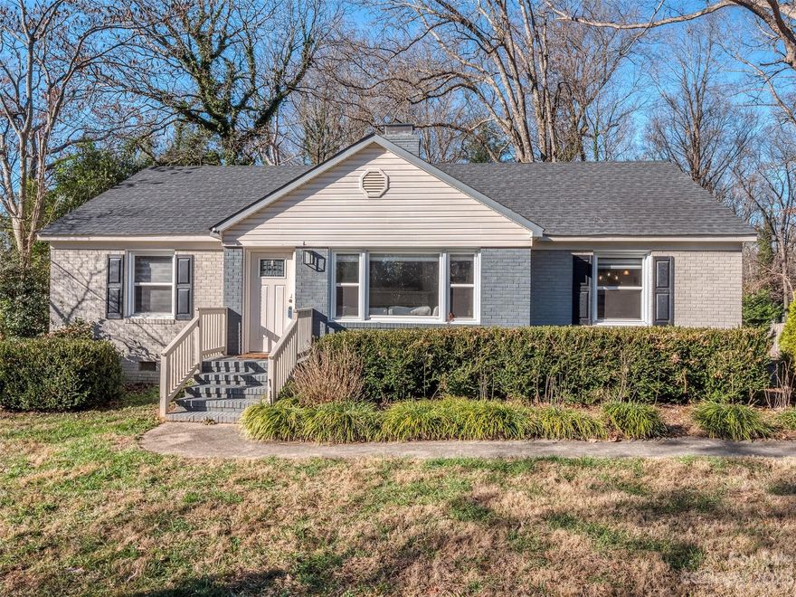 Looking for a fully updated home on a level over 3/4 of an acre lot minutes from Uptown Charlotte with a 2 car detached garage?  Look no further!  This amazing home features spectacular hardwood flooring in the foyer, great room, dining room & bedrooms. The updated kitchen has custom tile, a 4 burner ZLine Pro gas range/oven, microwave, granite counters, breakfast bar, subway tile backsplash & more! The primary suite has black out blinds/curtains & a HUGE custom walk-in closet! The primary bath has an updated walk-in tile shower & the guest room is spacious with access to an updated hall bath. The winding staircase leads to a private workspace or lounge area with built-ins.  The custom patio has nat. gas firepit, & outdoor kitchen with Blackstone Grill (propane) with custom cover & space for a large ceramic grill. The detached 2 car garage is wired for EV Charging & has plumbing both inside & out making it a perfect workshop. The lot extends over 160' beyond the garage!  Check it out!