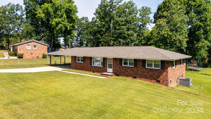 Discover the potential in this spacious 4-bedroom, 2.5-bath brick home nestled on a generous 0.41-acre lot in Oakwood Acres. Boasting a large recreation room perfect for entertaining or activities, this home also features a huge primary suite that offers a private retreat. The attached 2-car carport ensures convenient parking and storage. Step outside to a fenced backyard that provides both security and space for outdoor enjoyment, complemented by a handy storage building for all your tools and equipment. Inside, the kitchen is designed with a breakfast bar and a cozy dining area, making it ideal for both casual meals and formal dining. Located in a prime spot, this home offers easy access to shopping, dining, and the interstate, making your daily commute a breeze. While the home needs updating, it presents a fantastic opportunity to create your dream space in a great location. Don't miss out on the chance to make this house your own!