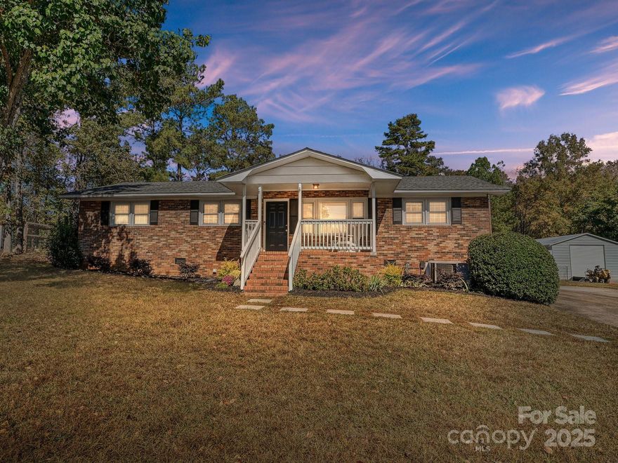 Sitting proudly atop a gentle hill, far off the road, this all-brick ranch offers the perfect blend of comfort, character, and functionality. Less than 10 minutes to the heart of York, SC, you cannot beat this scenic location with a country-living feel! Enjoy a level, fully fenced backyard complete with a newly installed patio—ideal for entertaining or unwinding outdoors. The 20x30 detached shop provides ample space for storage, hobbies, or projects, while the built-in kennels can serve as additional storage space, if animals aren’t your thing. 

Inside, you’ll find a bright and inviting kitchen with fresh white cabinetry, granite countertops, and stainless steel appliances. Per the previous seller, the HVAC and roof are approx. 5 years old. A fully updated full bathroom serves two spacious secondary bedrooms. The large dining & sitting area off the cozy living room creates an open, welcoming flow throughout the main living spaces. With new carpet, fresh interior paint, and thoughtful updates, this charming home is move-in ready and waiting for you to make it your own!