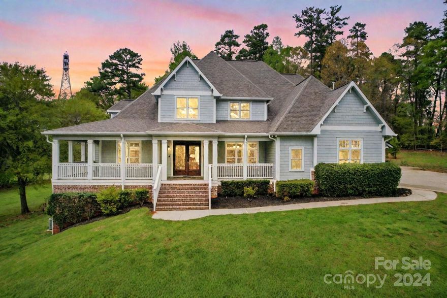 Spectacular custom home in the exclusive gated Stillwell community.  You'll love the private, tranquil setting nestled at the end of a cul-de-sac on 3.49 acres w/direct access to walking trails & Catawba River.  The inviting wraparound front porch leads to custom iron french doors opening to a beautiful entryway.  Main level highlights include a private office (w/separate exterior entrance), grand owners suite, gourmet kitchen full of natural light & a gorgeous covered patio to enjoy outdoor living. Up either staircase you'll find 3 large ensuite bedrooms, 5th bedroom & laundry. The lower level will WOW you w/a full kitchen, bedroom, bathrooms & huge gathering spaces - perfect for second living quarters! To make this house even more amazing - it was designed to accommodate a pool just outside the lower level sliding doors. Surrounded by nature preserves, minutes from excellent shopping, dining & medical, an easy commute to downtown CLT and the airport, this home literally has it all!