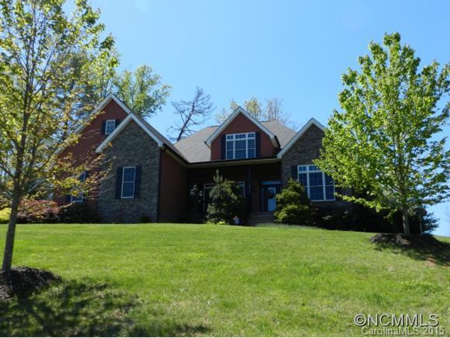 Beautiful builders own custom home w/ year round views! Soaring ceilings, hickory and tile floors, & maple glazed cabinets. Office (w/ closet) PLUS bonus/game room with SURROUND SOUND. Triple attached garage, PLUS double detached garage with loft and workshop space. Professionally landscaped yard, with backyard privacy. Too many additional features, please see attached Features Sheet.