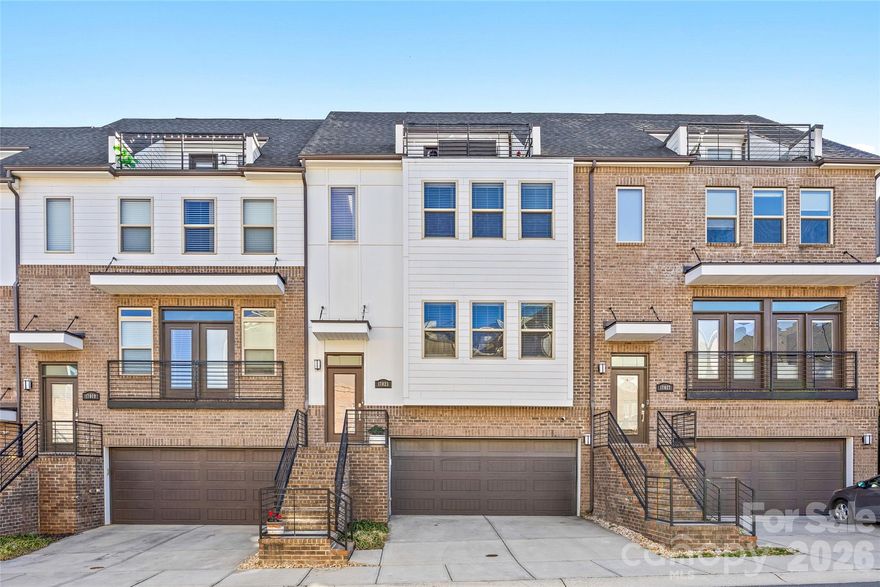 Live at the intersection of lifestyle and location in this exceptional Charlotte townhome just minutes from Uptown, or head the other direction to some of the best bars, restaurants and retail in the adjacent neighborhoods of Midwood and Elizabeth. Catch a play Uptown, Hornets or Panthers game—then be home in minutes. Inside, natural light pours through the open-concept main level, highlighting a designer kitchen with custom cabinetry, built-ins, and an adjacent office space outfitted for multiple monitors—ideal for working from home without sacrificing style. All appliances, including the washer and dryer, are included. Downstairs, the fully sound-proofed, custom-built home theater is a true showpiece. Professionally finished with sleek black walls for an authentic cinematic feel, the premium $1,000 impact screen is engineered for a golf simulator and doubles seamlessly as a high-end movie screen—perfect for entertaining or dialing in your swing year-round. Upstairs, the spacious primary suite delivers a spa-level bath with dual vanities, dual shower heads, and custom closet organization. Two additional bedrooms, four and a half baths, and a two-car garage provide flexibility and function. Top it off with a rooftop terrace offering sweeping city views—your private escape above it all. This is elevated Charlotte living.